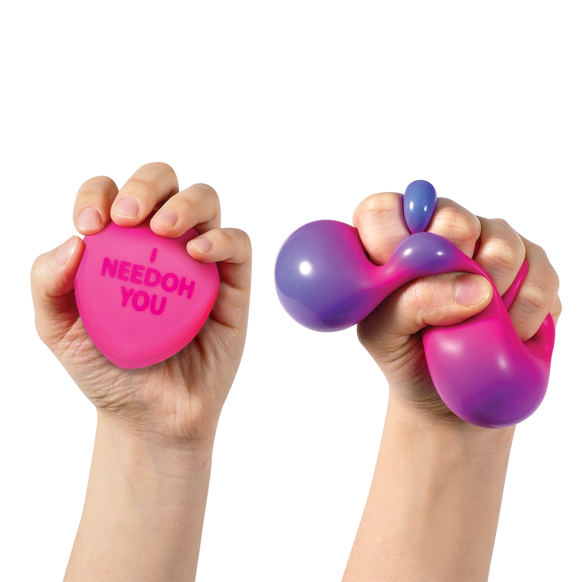 Color Change Squeeze Heart S3 - Two hands squeezing colorful sensory hearts. The left hand holds a pink heart-shaped sensory toy with the words "I YOU" printed on it. The right hand is squeezing a fluid, malleable sensory toy that transitions from pink to purple.